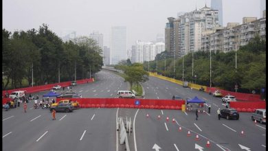 China relaxes some Covid laws even as cases top 10,000 |  World news