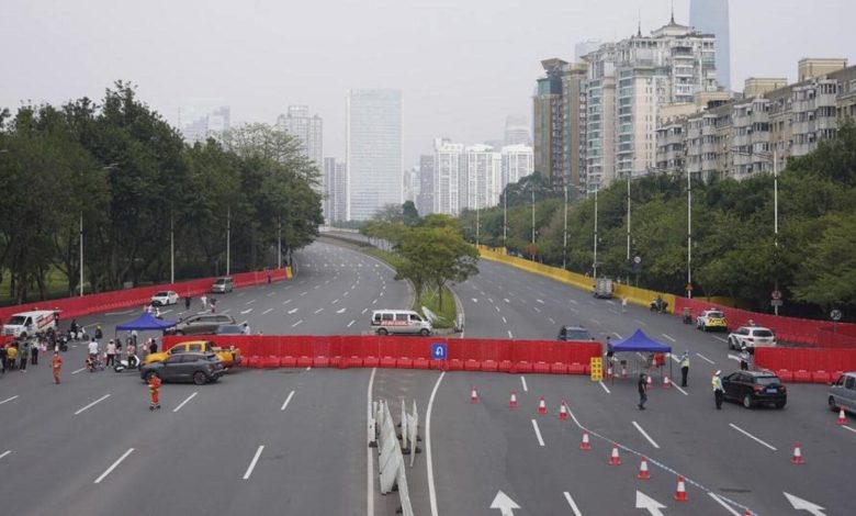 China relaxes some Covid laws even as cases top 10,000 |  World news