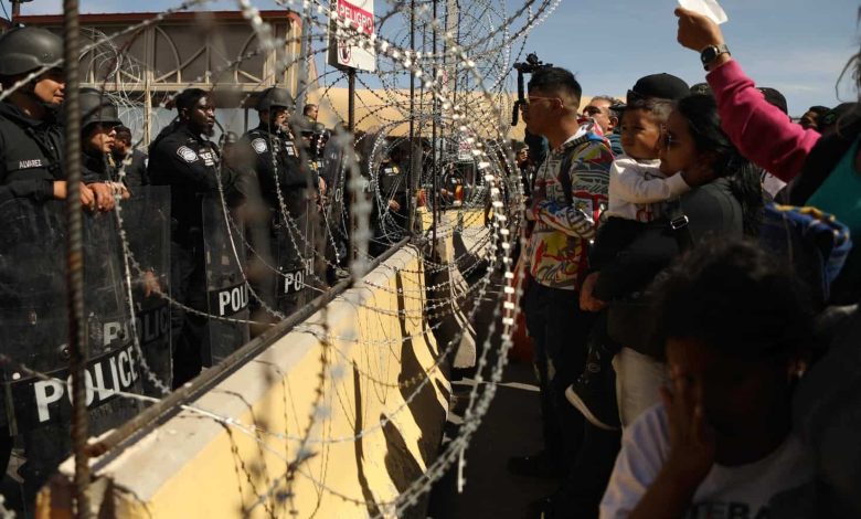 Watch: Crowds of migrants try to fight US-Mexico border |  World news